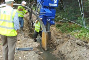 INSTALLING THE VERTICAL GAS CURTAIN AROUND THE INFILLED PITS TO PROTECT OFF SITE RECEPTORS