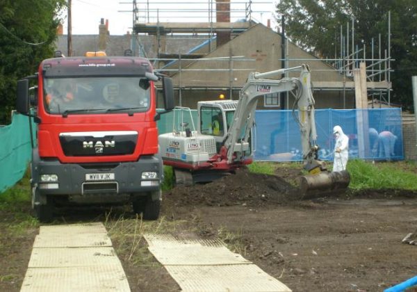 MISTING SOILS WHILST LOADING TO PREVENT AIR BORNE FIBRES